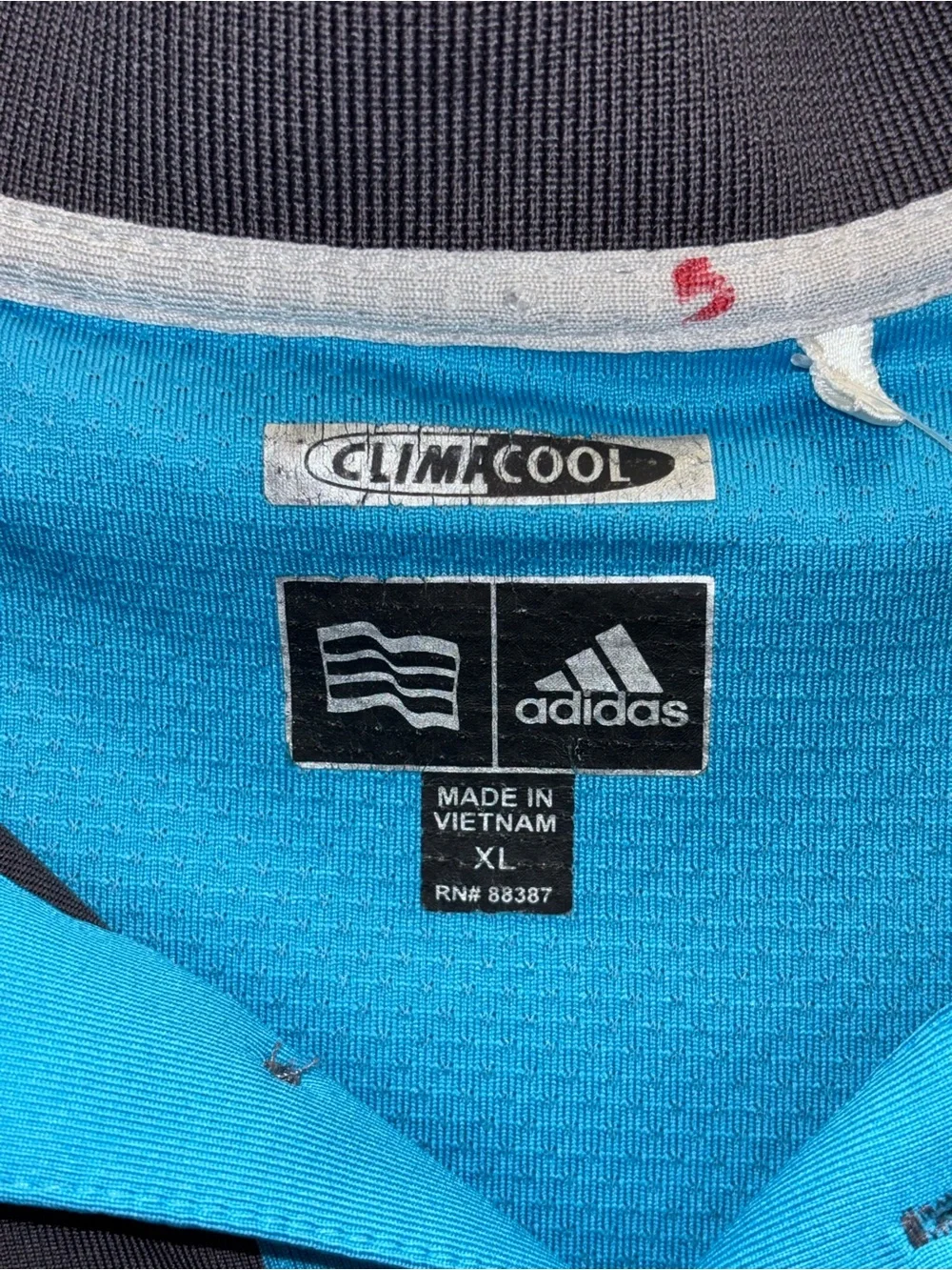 adidas Men’s Dark Navy Polo with Bright Turquoise Inner Placket